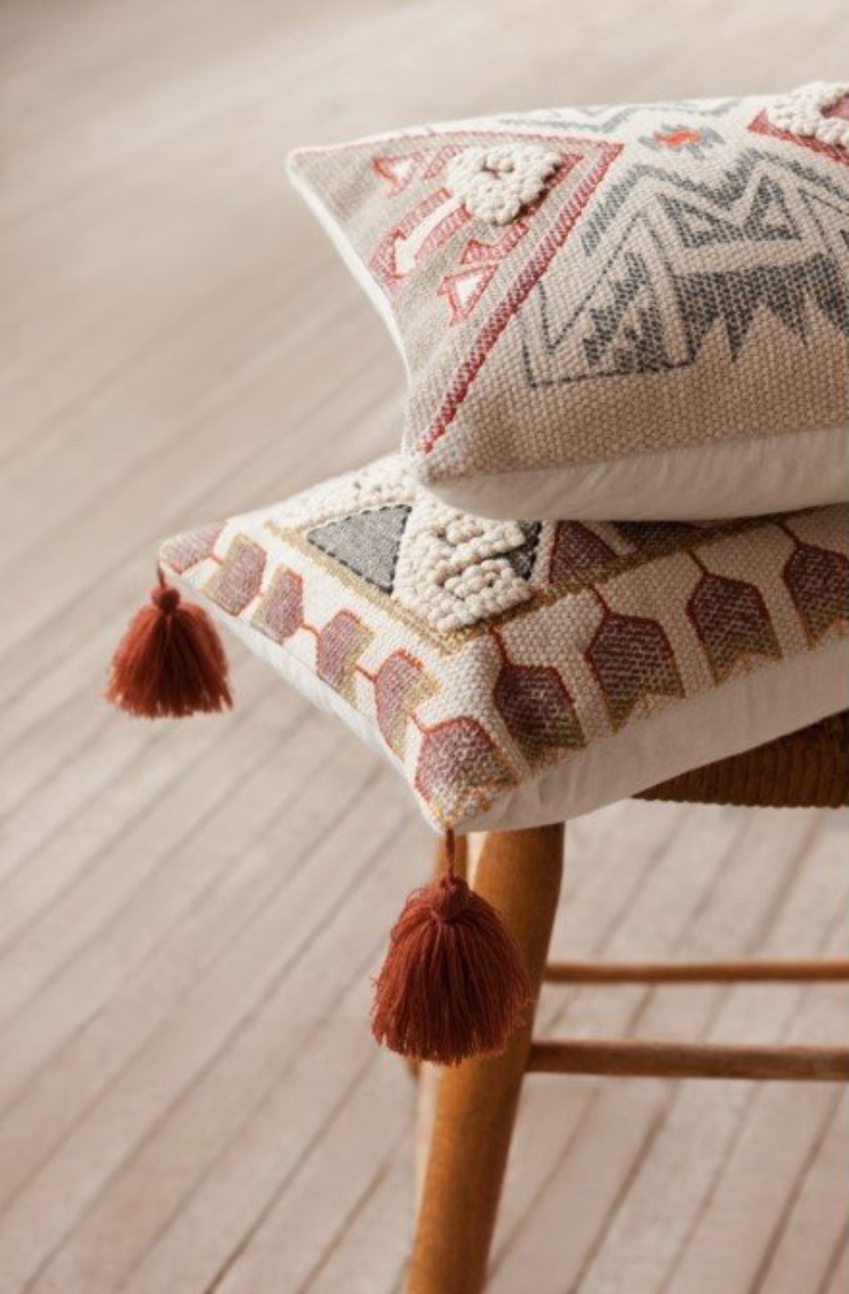 Embossed Pillow with Red Tassel