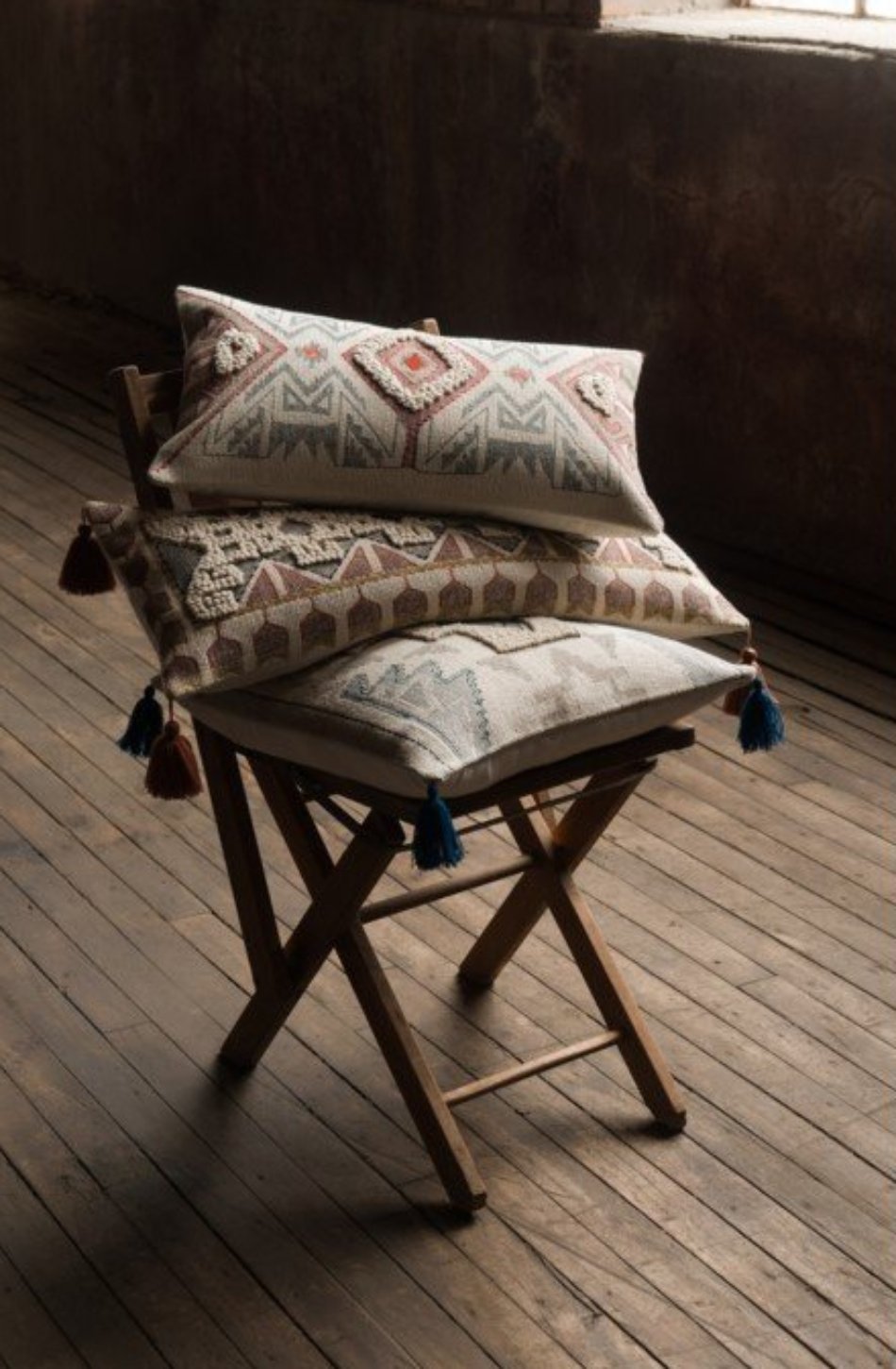 Embossed Pillow with Red Tassel