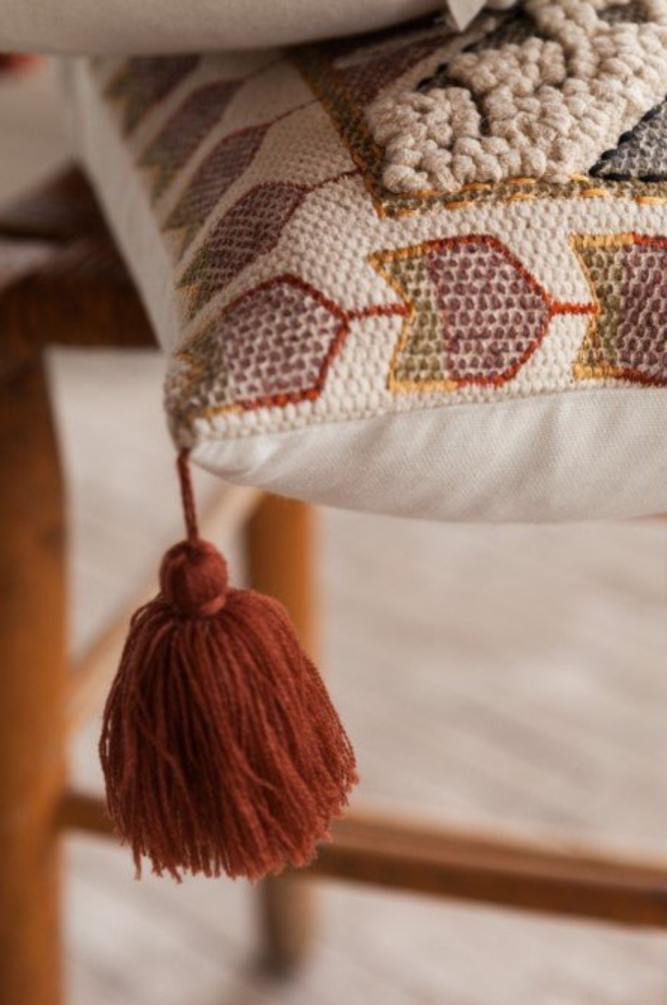 Embossed Pillow with Red Tassel